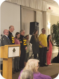 Guest speakers and supporters on stage at the Strutting Acceptance fashion show